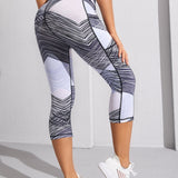 Yoga Future Leggings deportivos de color combinado de rayas & con bolsillo de celular