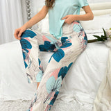 Conjunto De Pijama Para Mujeres Con Parte Superior De Color Puro Y Pantalones Con Impresion Floral