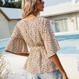 Unity Top peplum floral con cinturon de cuello cruzado