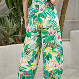 Unity Pantalones de cintura con volante con abertura lateral con estampado tropical