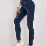 Frenchy Jeans ajustados de talle alto con diseno roto