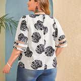 Blusa con estampado de hoja panel con malla de cuello V