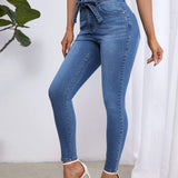 Essnce Jeans ajustados de talle alto con cinturon