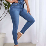 Essnce Jeans ajustados de talle alto con cinturon