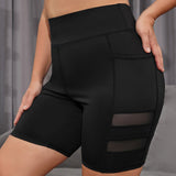 Yoga Basic Pantalones cortos deportivos de talla grande con panel de malla y bolsillo para telefono, pantalones cortos de legging