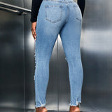 SXY Jeans ajustados con abertura desgarro crudo