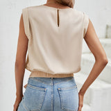 Blusa de cuello redondo bajo con nudo