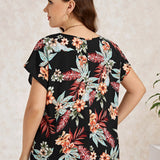 Blusa con estampado tropical de manga murcielago