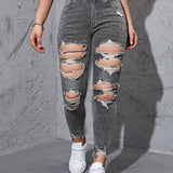 Jeans ajustados desgarro con abertura