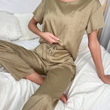 Conjunto de pijama pantalones con camiseta unicolor con parche con bolsillo