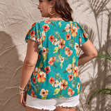 a grande Blusa con estampado tropical de manga mariposa