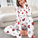 Conjunto de pijama pantalones con camiConjuntoa con estampado de corazon