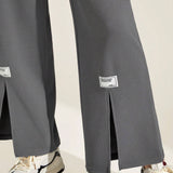 Mulvari Pantalones con parche de letra con bolsillo oblicuo bajo con abertura
