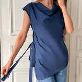 Blusa escote drapeado con nudo lateral bajo asimetrico