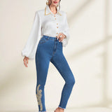 Prive Jeans ajustados con dobladillo sin rematar y parche floral