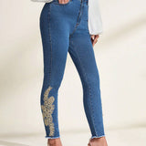 Prive Jeans ajustados con dobladillo sin rematar y parche floral