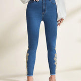 Prive Jeans ajustados con dobladillo sin rematar y parche floral