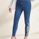 Prive Jeans ajustados con dobladillo sin rematar y parche floral