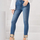 Prive Jeans ajustados con bordado floral aplique