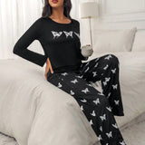 Conjunto de pijama pantalones con camiConjuntoa con estampado de mariposa