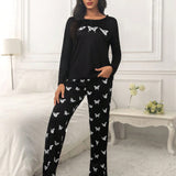 Conjunto de pijama pantalones con camiConjuntoa con estampado de mariposa