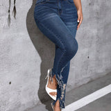 Jeans ajustados bajo con fleco