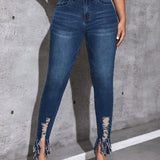 Jeans ajustados bajo con fleco