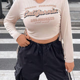 TALLA grTALLAnde CTALLAmisetTALLA crop con estTALLAmpTALLAdo de slogTALLAn con cordon lTALLAterTALLAl