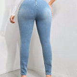 SXY Jeans ajustados con abertura lateral