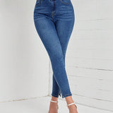 LUNE Jeans ajustados de talle alto bajo con abertura