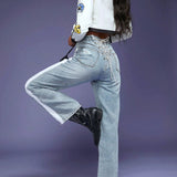 Haute Jeans Con Cordones En La Espalda Y Laterales En Contraste