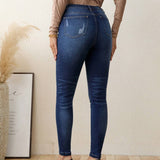 LUNE Jeans ajustados con boton de talle alto