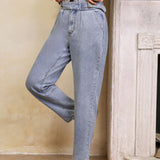LUNE Jeans conicos hebilla cintura