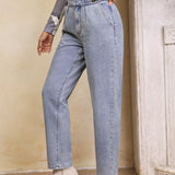 LUNE Jeans conicos hebilla cintura