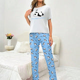 Conjunto de pijama pantalones con camiConjuntoa con estampado de panda y slogan