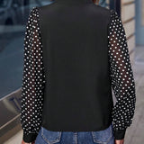 Blusa con estampado de lunares de cuello notch