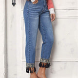 LUNE Jeans conicos con flecos bajo
