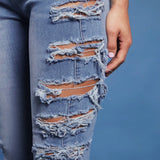 Haute Jeans Rasgados Ajustados A La Cintura Alta Con Detalle En Los Lados