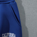 Unity Pantalones deportivos con capucha con estampado de letra