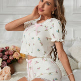 Conjunto de pijama floral para mujeres con ribete de encaje, nudo decorativo y mangas infladas con shorts