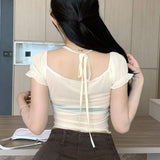 Dazy Designer Blusa de verano para mujer con cuello halter de color solido, manga corta holgada y diseno transparente