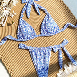 Conjunto de bikini de cuello halter con estampado floral de la serie de vacaciones de moda para mujeres