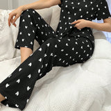 Conjunto de pijama de manga corta con nudo de mariposa y pantalon largo con estampado de corazon para mujer