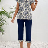 EMERY ROSE Conjunto de dos piezas para damas, con top y pantalon corto con estampado cortado al azar y manga corta.