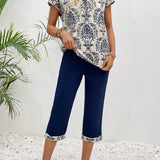 EMERY ROSE Conjunto de dos piezas para damas, con top y pantalon corto con estampado cortado al azar y manga corta.