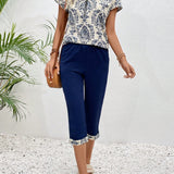 EMERY ROSE Conjunto de dos piezas para damas, con top y pantalon corto con estampado cortado al azar y manga corta.