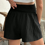 Shorts plisados de talle alto y pierna ancha texturizados en color solido para maternidad en verano