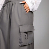 Coolane Pantalones cargo holgados con cordon y bolsillos estilo callejero para Primavera/Verano 2024