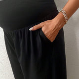 Pantalones sueltos de maternidad con soporte para vientre y hebilla ajustable