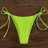 Bottom de bikini con lazo lateral y diamantes en forma de corazon de color verde fluorescente